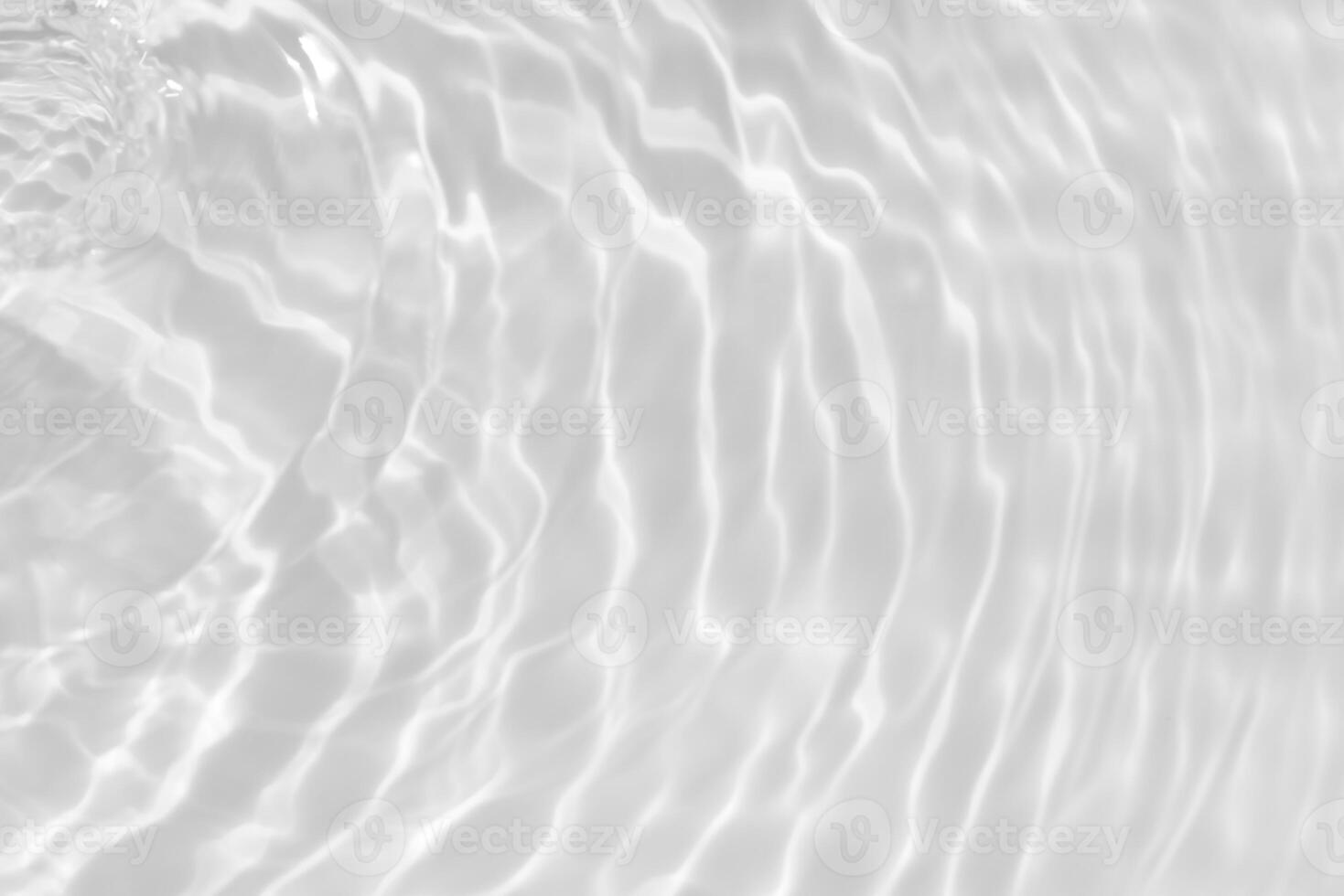 Water surface. Bluewater waves on the surface ripples blurred. Defocus blurred transparent blue colored clear calm water surface texture with splash and bubbles. Water waves with shining pattern. photo