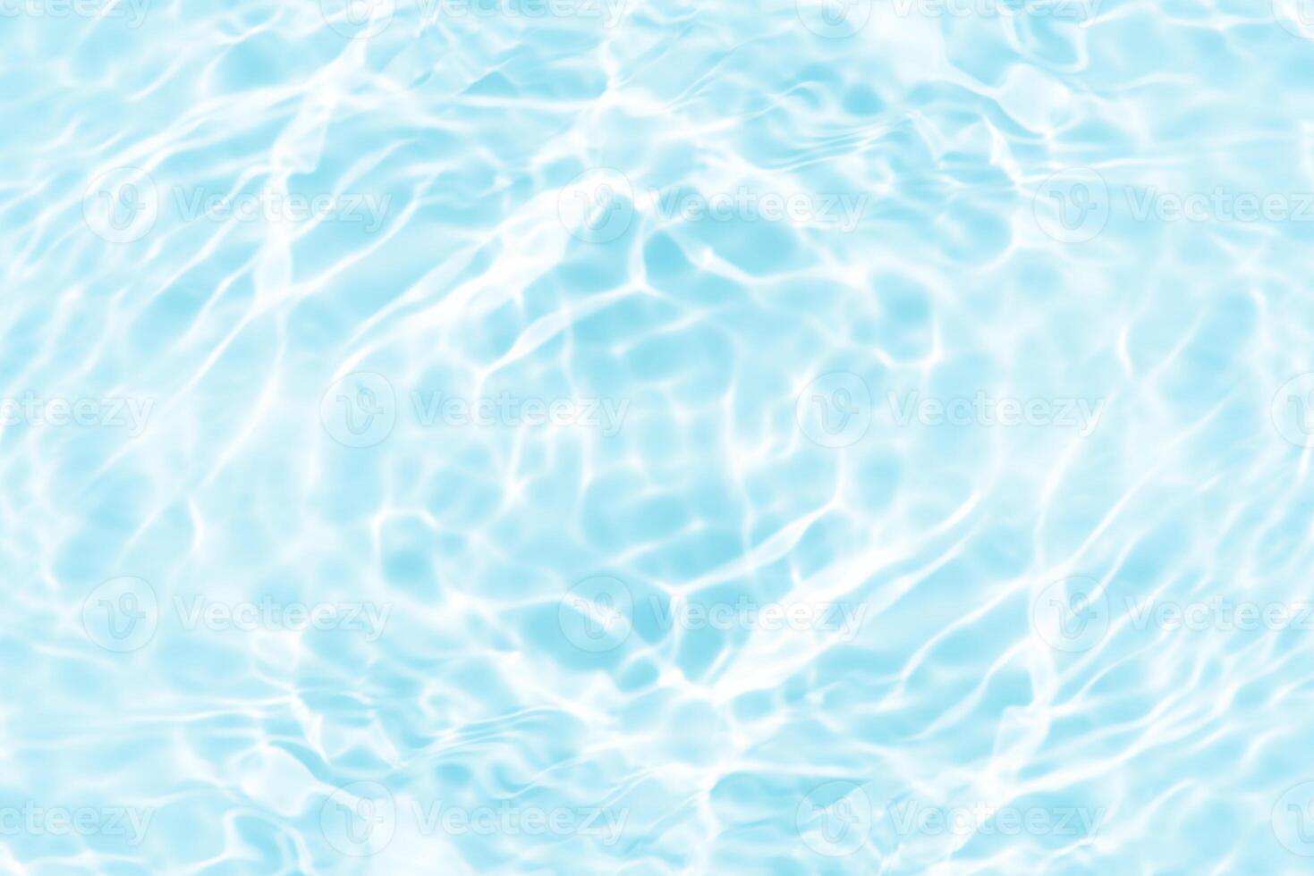 Water surface. Bluewater waves on the surface ripples blurred. Defocus blurred transparent blue colored clear calm water surface texture with splash and bubbles. Water waves with shining pattern. photo