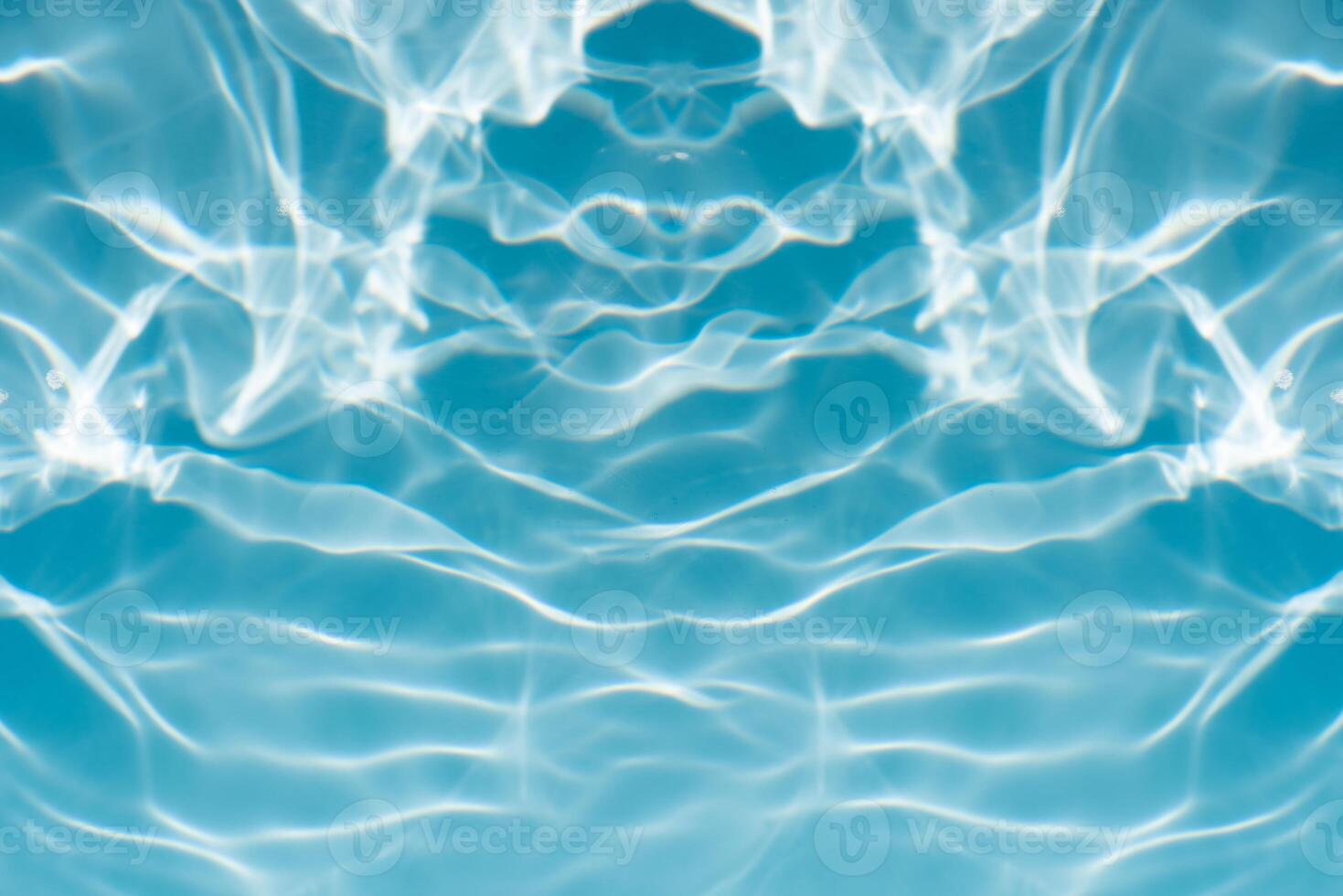 Bluewater waves on the surface ripples blurred. Defocus blurred transparent blue colored clear calm water surface texture with splash and bubbles. Water waves with shining pattern texture background. photo