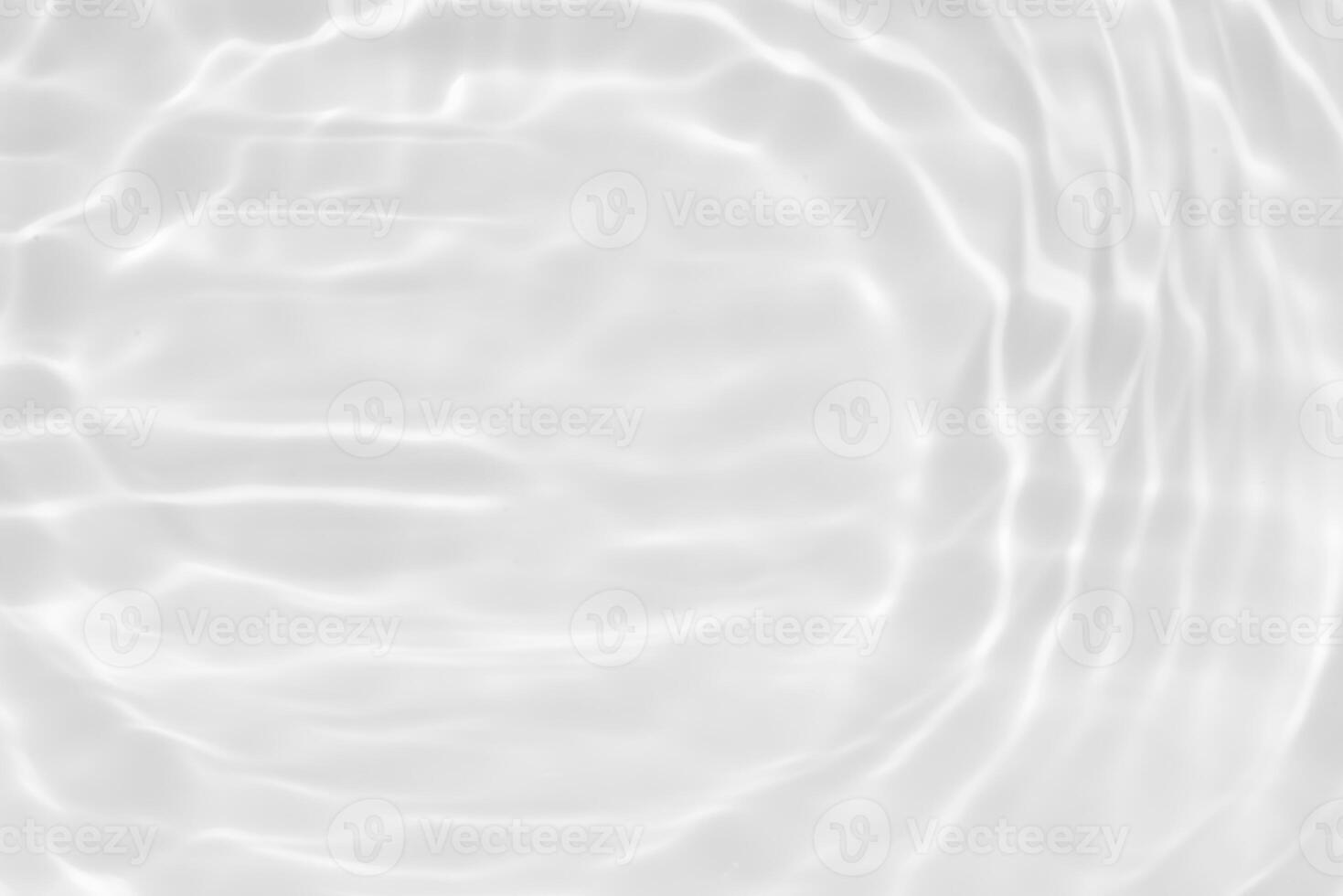 Bluewater waves on the surface ripples blurred. Defocus blurred transparent blue colored clear calm water surface texture with splash and bubbles. Water waves with shining pattern texture background. photo