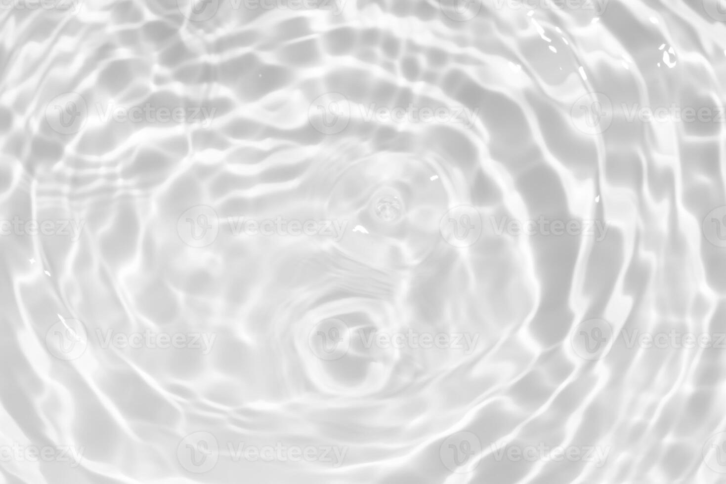 Water surface. Bluewater waves on the surface ripples blurred. Defocus blurred transparent blue colored clear calm water surface texture with splash and bubbles. Water waves with shining pattern. photo