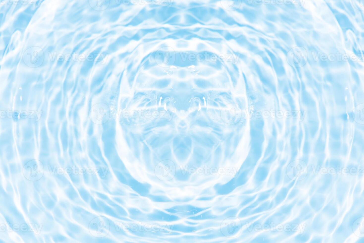 Bluewater waves on the surface ripples blurred. Defocus blurred transparent blue colored clear calm water surface texture with splash and bubbles. Water waves with shining pattern texture background. photo