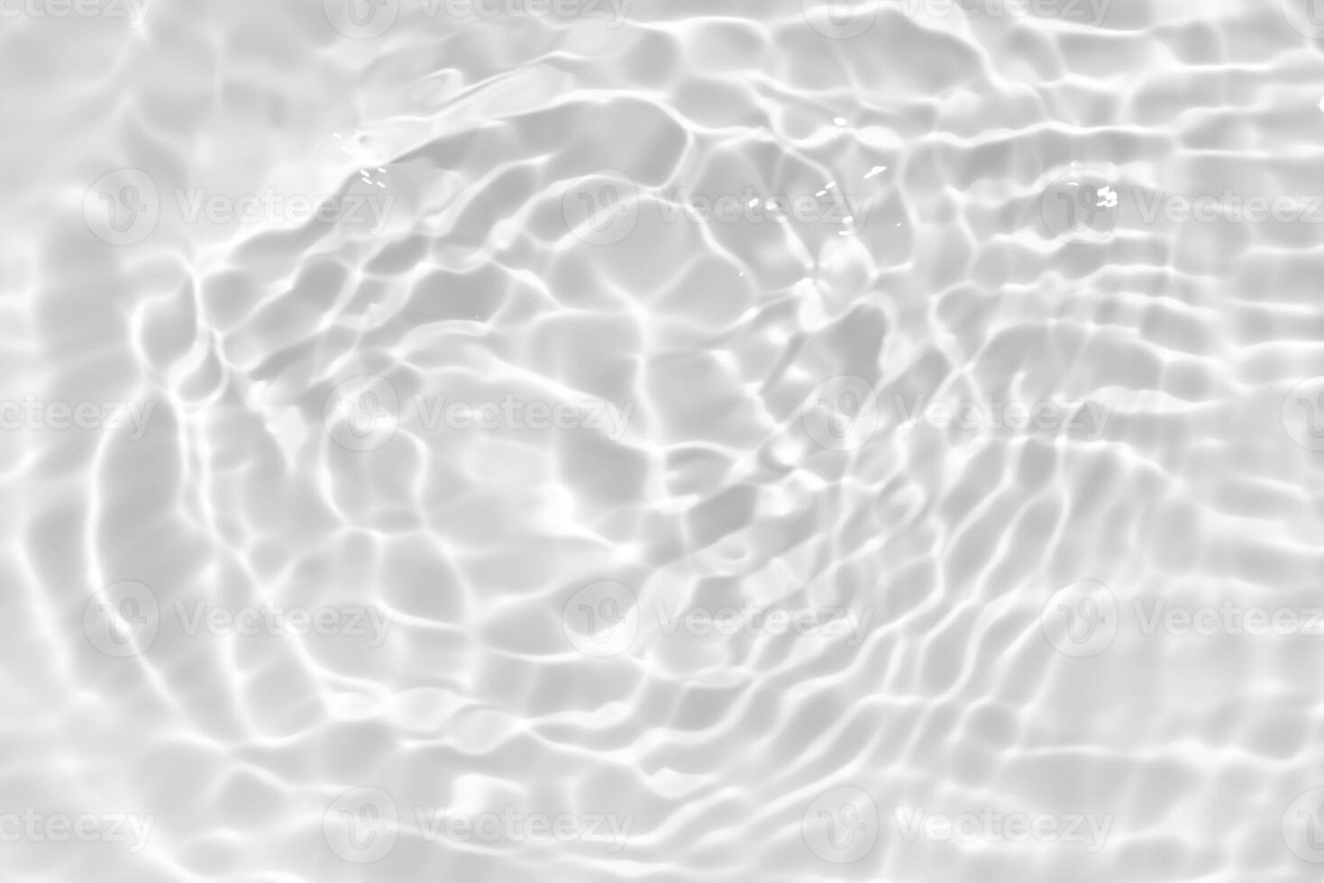 White water with ripples on the surface. Defocus blurred transparent white colored clear calm water surface texture with splashes and bubbles. Water waves with shining pattern texture background. photo