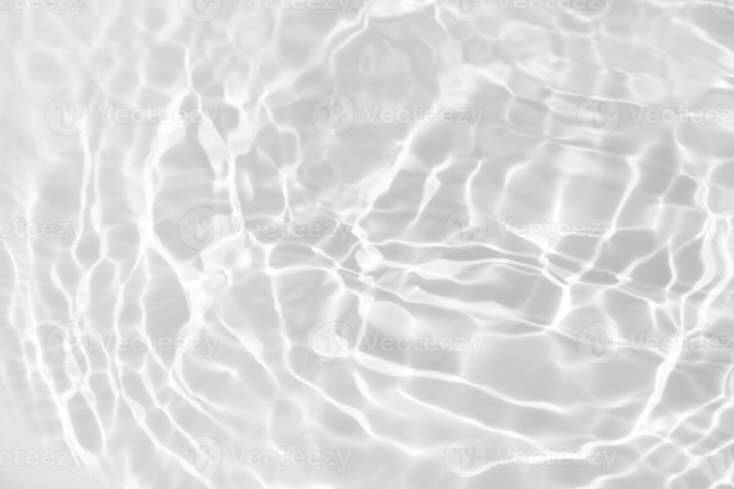 Water surface. Bluewater waves on the surface ripples blurred. Defocus blurred transparent blue colored clear calm water surface texture with splash and bubbles. Water waves with shining pattern. photo