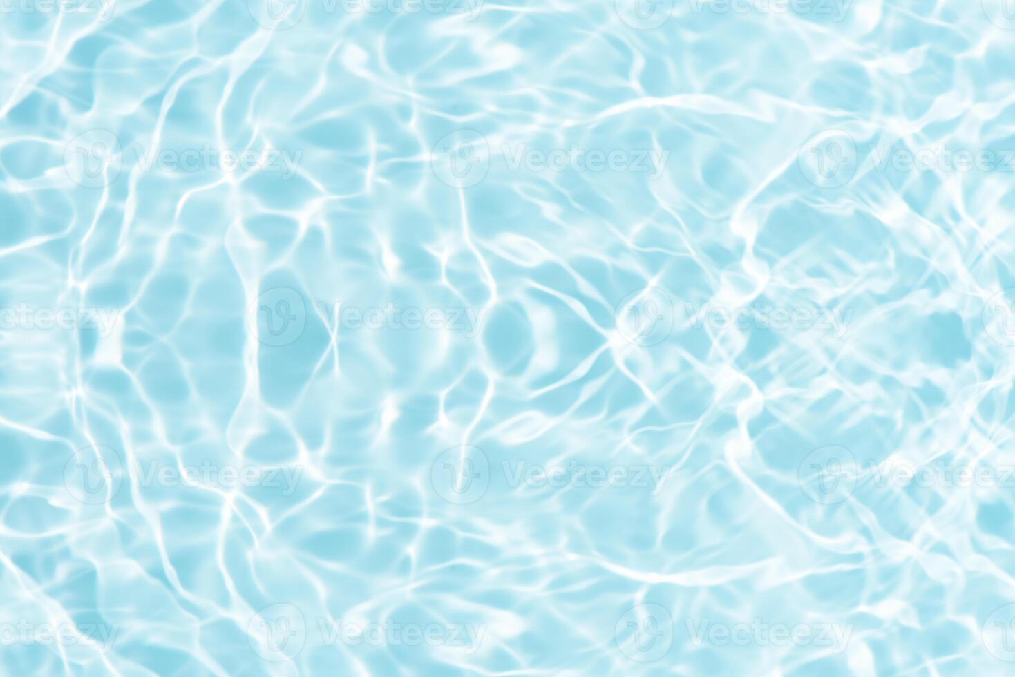 Bluewater waves on the surface ripples blurred. Defocus blurred transparent blue colored clear calm water surface texture with splash and bubbles. Water waves with shining pattern texture background. photo
