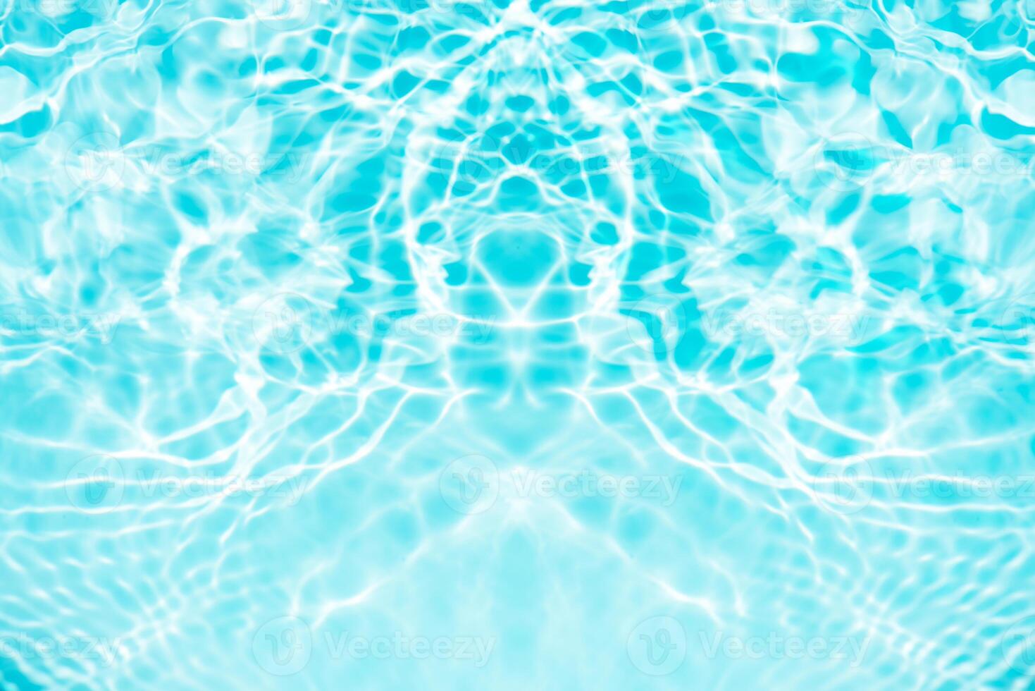 Water surface. Bluewater waves on the surface ripples blurred. Defocus blurred transparent blue colored clear calm water surface texture with splash and bubbles. Water waves with shining pattern. photo