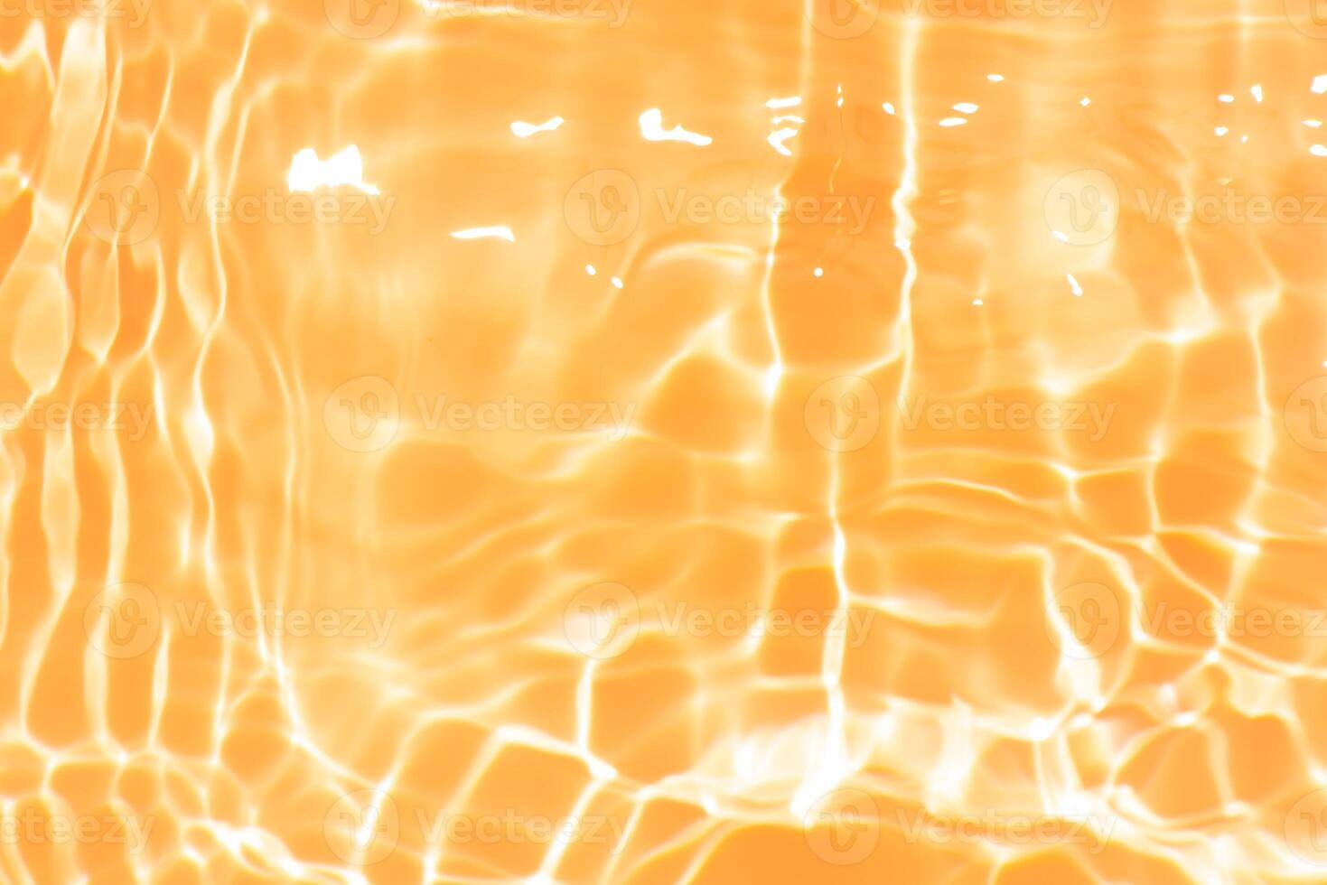 Bluewater waves on the surface ripples blurred. Defocus blurred transparent blue colored clear calm water surface texture with splash and bubbles. Water waves with shining pattern texture background. photo