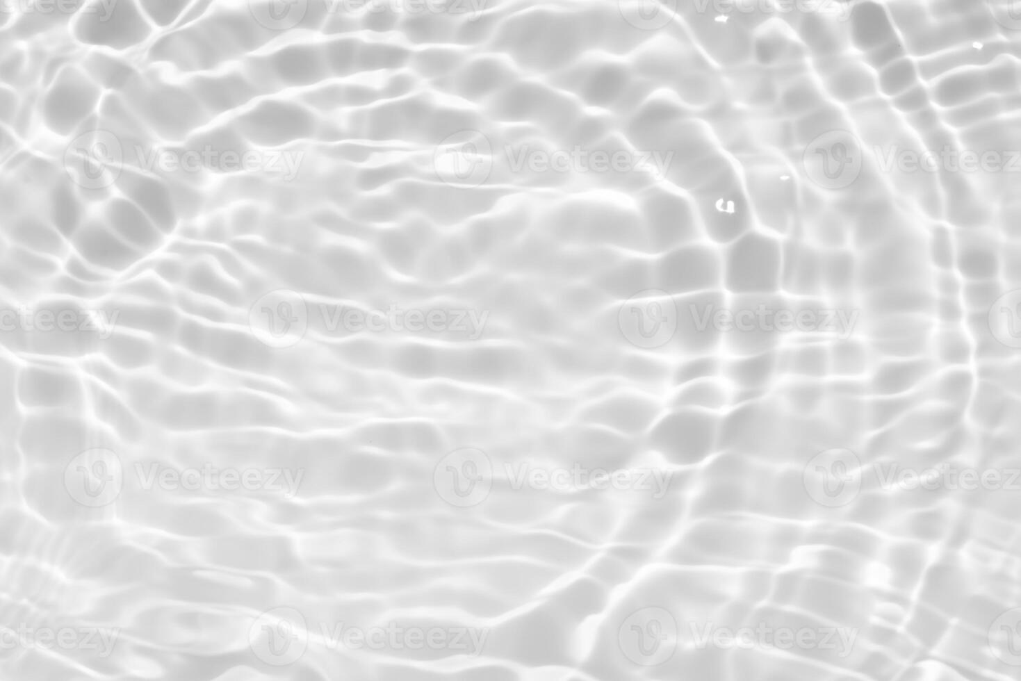 Water surface. Bluewater waves on the surface ripples blurred. Defocus blurred transparent blue colored clear calm water surface texture with splash and bubbles. Water waves with shining pattern. photo