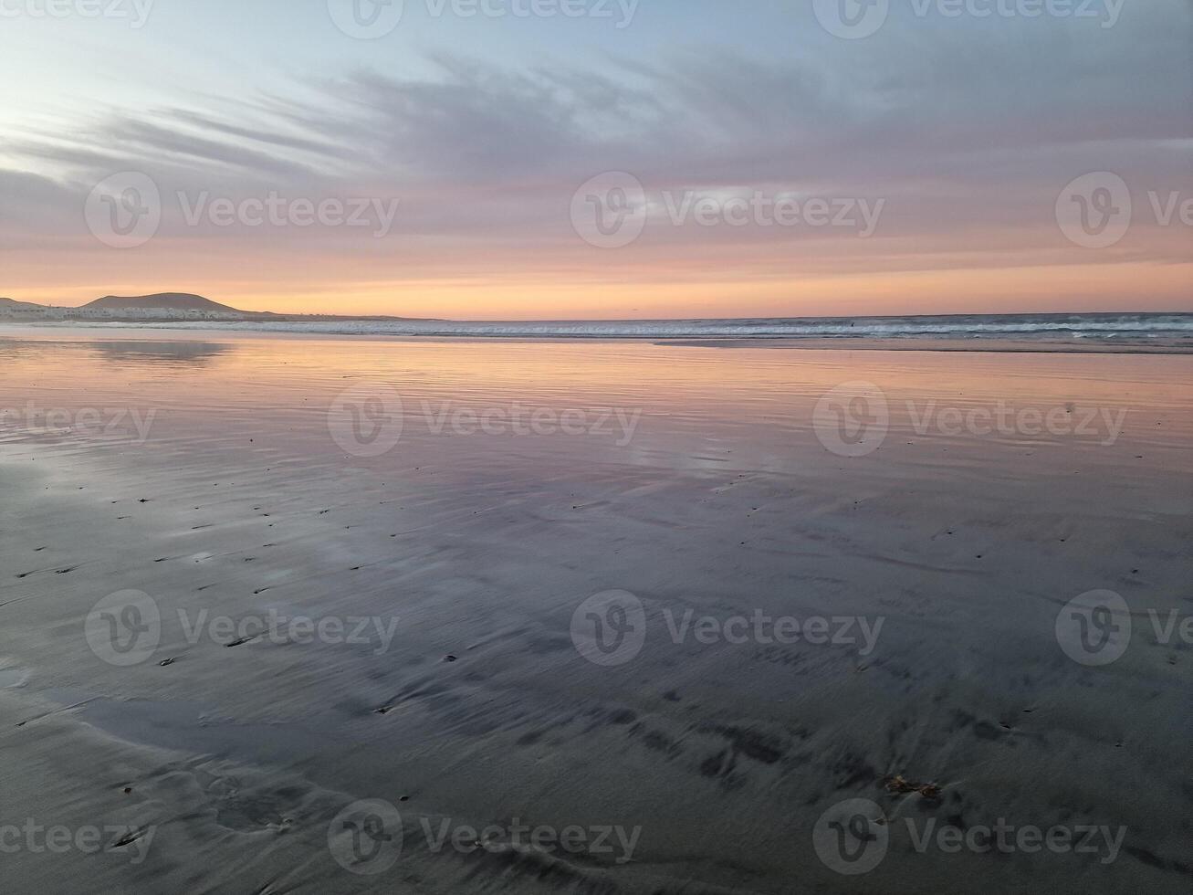 Sunset on Famara Beach on Lanzarote Island photo