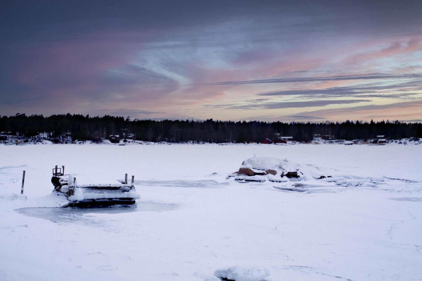 Beautiful afternoon on a frozen lake in Sweden photo