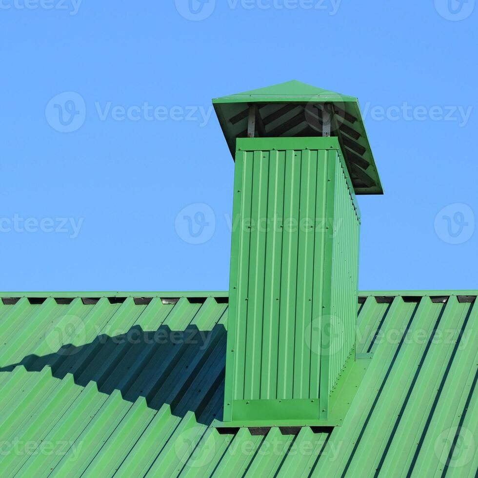 Hood on the roof of metal sheets photo