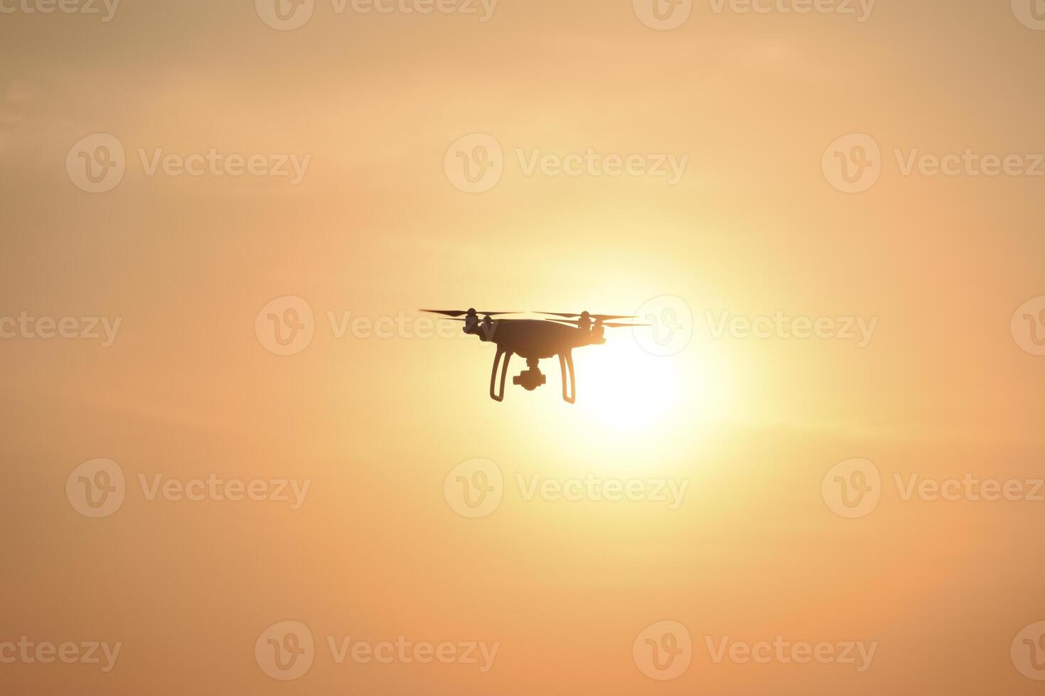 drone silhouette against the background of the sunset photo