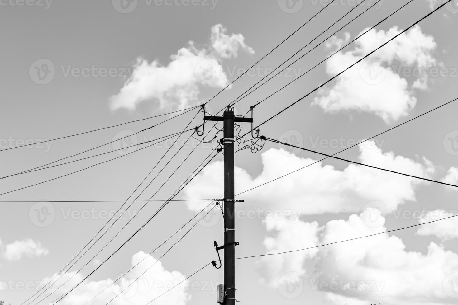 Power electric pole with line wire on light background close up photo