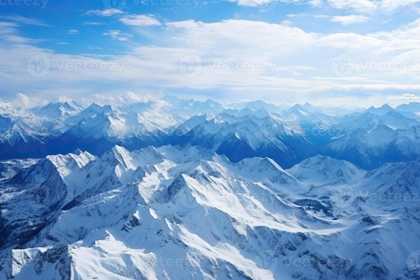 AI generated Aerial view of the peaks of snow-capped mountains. Generated by artificial intelligence photo