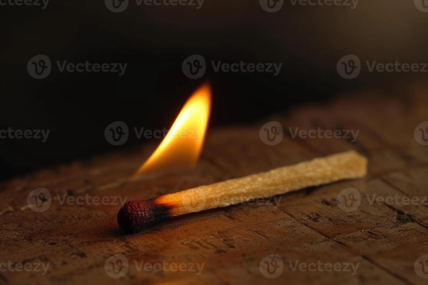 AI generated Lighted matchstick rests on a textured brown wooden surface photo