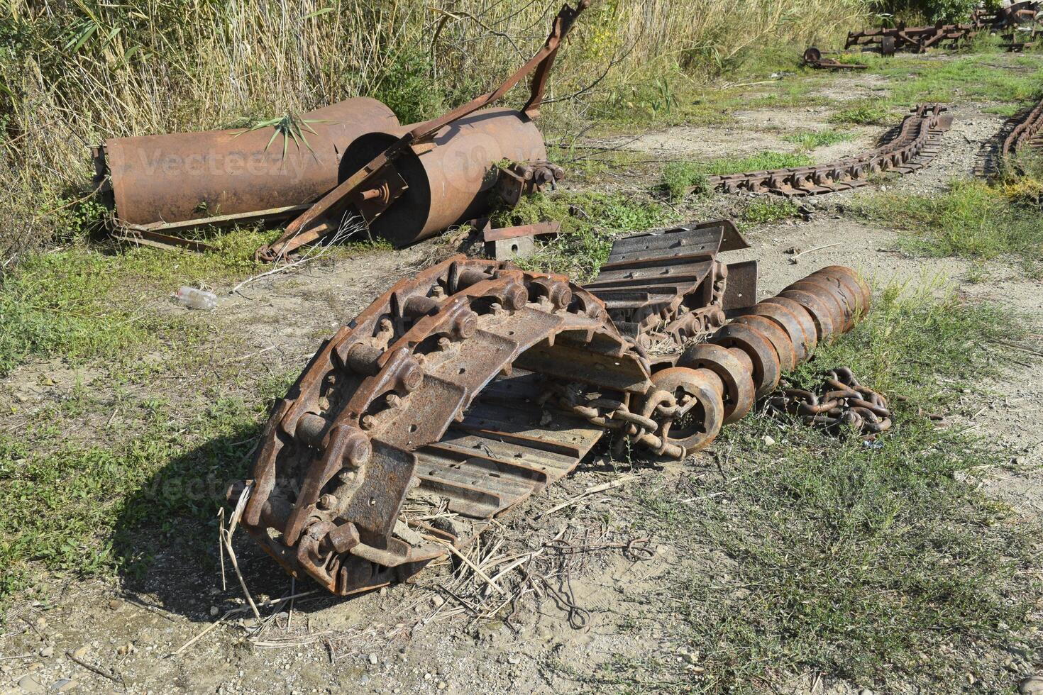 Old caterpillar tract from the combine photo