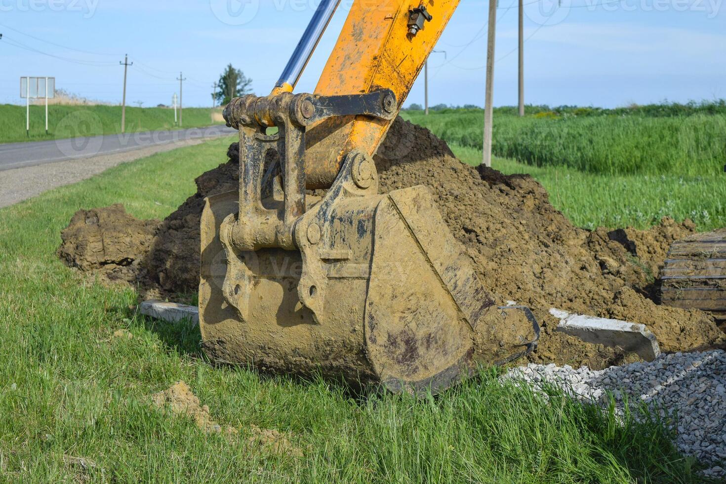 Bucket of the excavator on installation photo