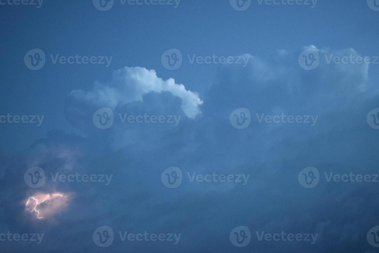 Lightnings in storm clouds photo