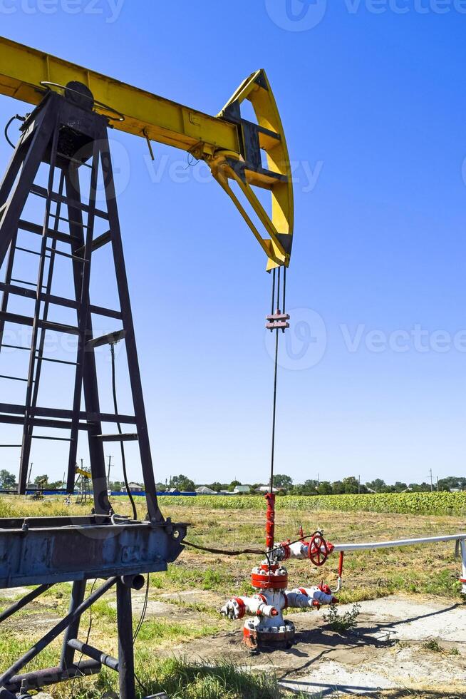 Pumping unit as the oil pump installed on a well photo