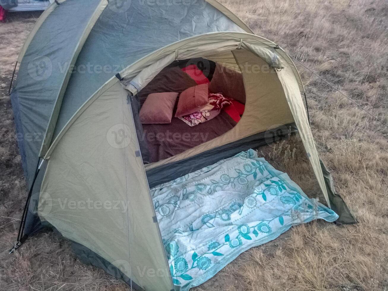 Set up a tent on the grass green photo