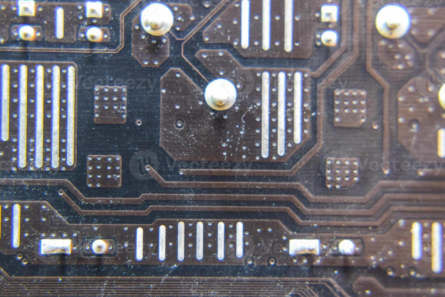 The reverse side of the microboard. Contacts solder. Soldered parts. Electronic board with electrical components. Electronics of computer equipment photo