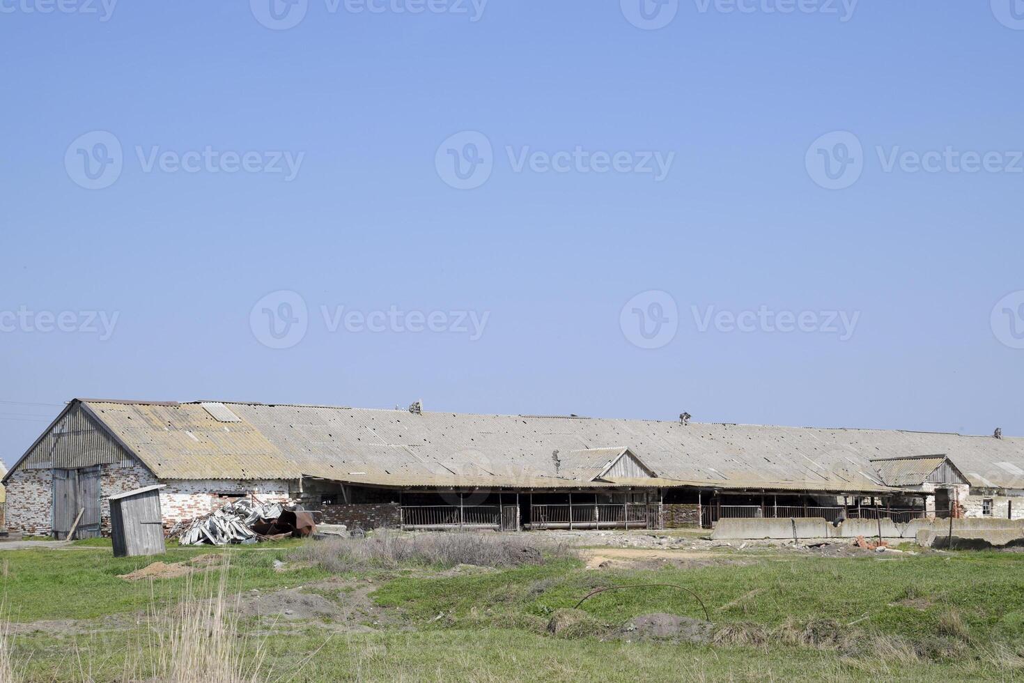 Old farm building. Leaky slate roof on the farm photo