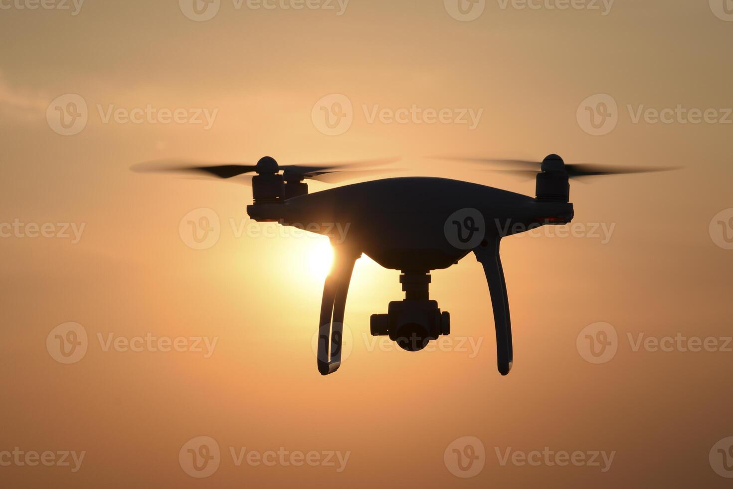 drone silhouette against the background of the sunset photo