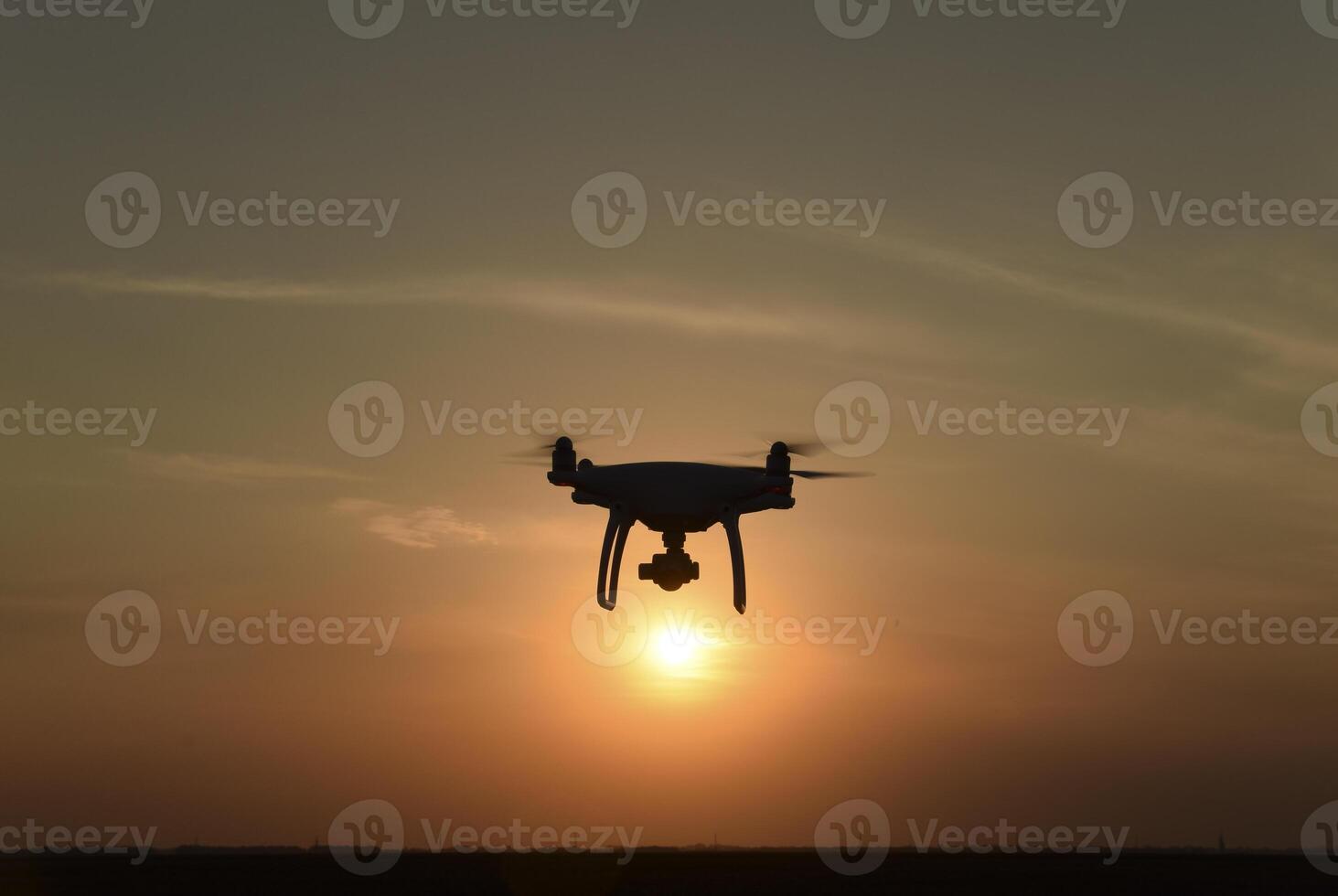 drone silhouette against the background of the sunset photo