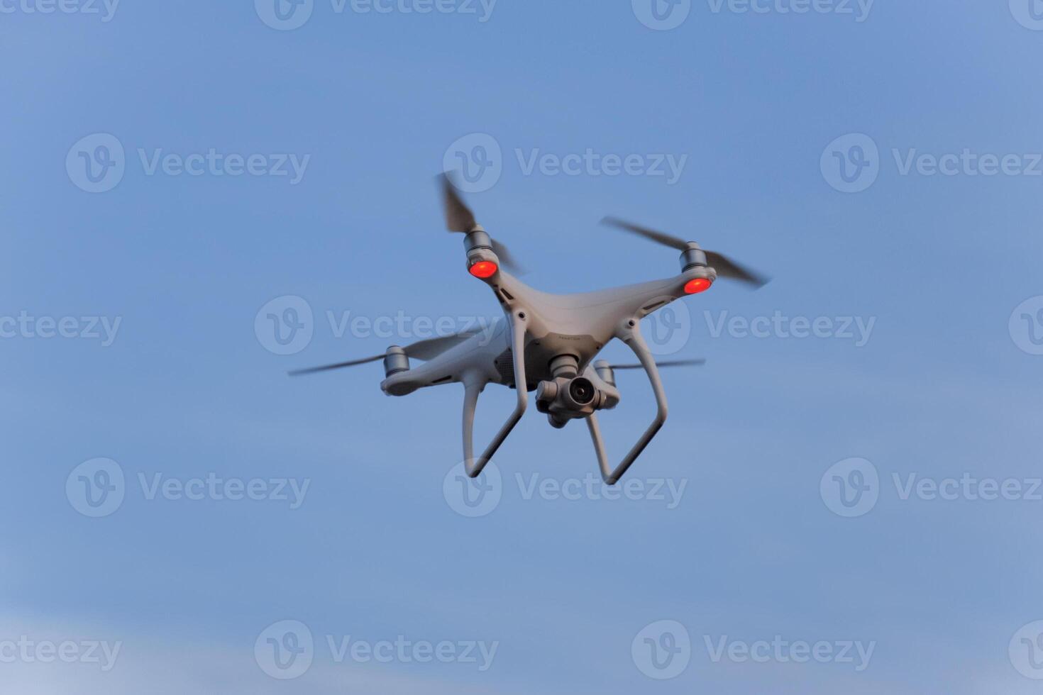 The drone, hovering in the sky. Flight quadrocopters photo