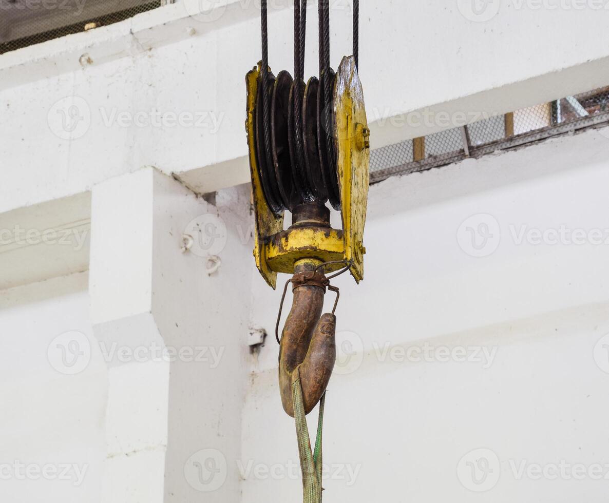 Hoist with winch and hook. A tool for moving goods in a producti photo