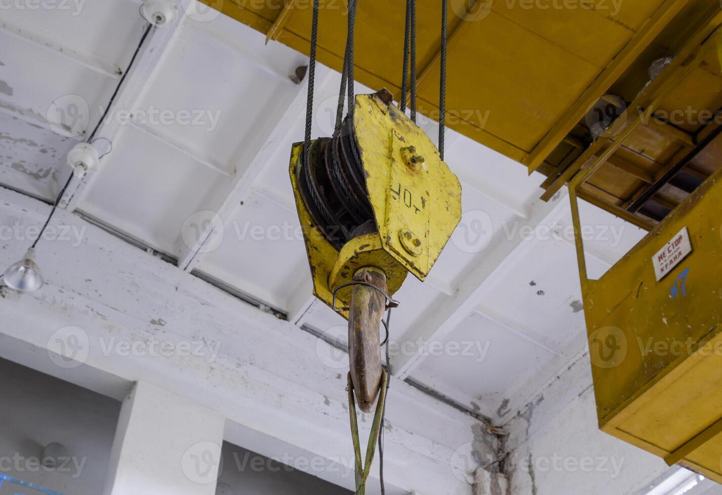 Hoist with winch and hook. A tool for moving goods in a producti photo