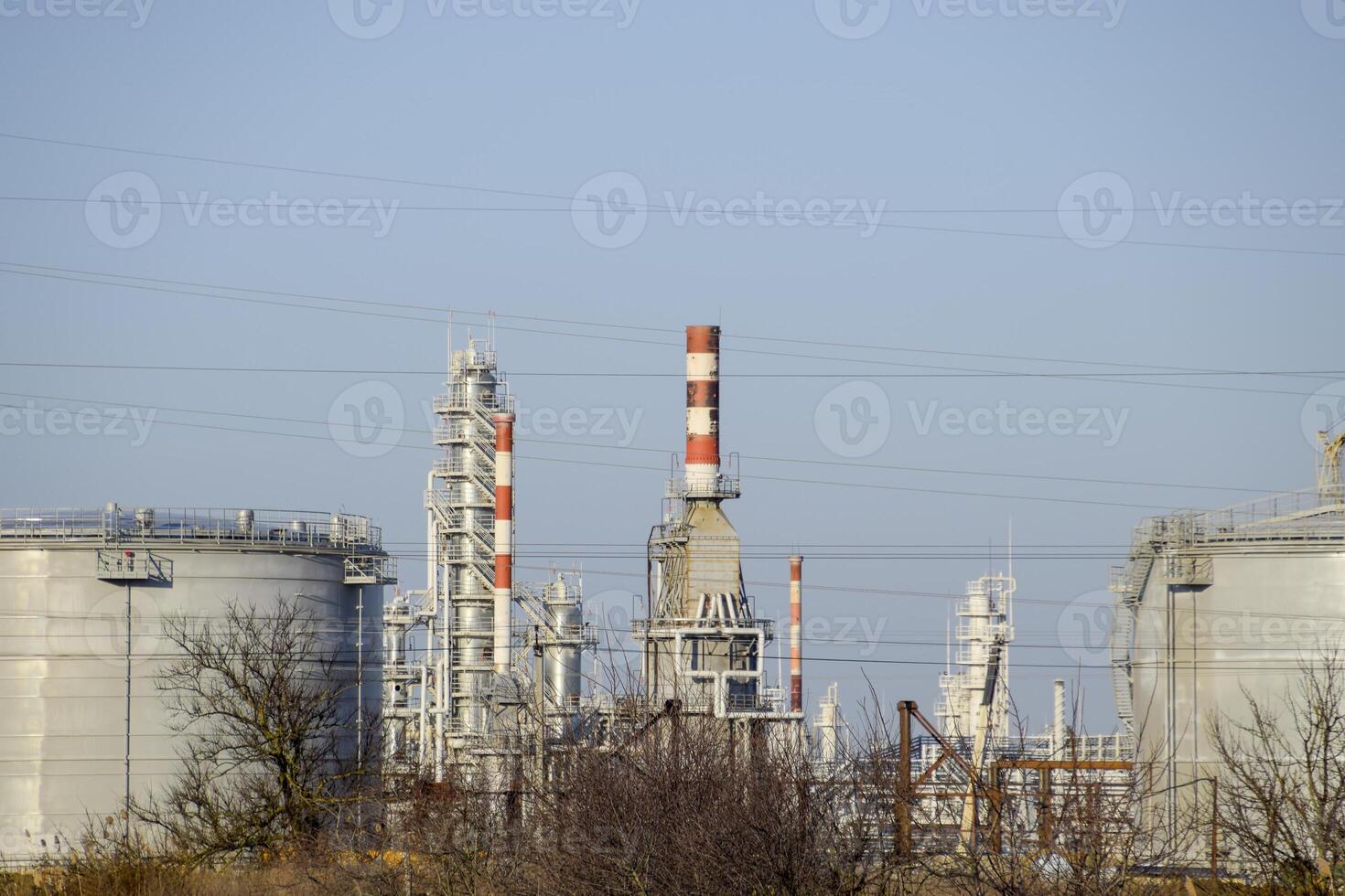 Distillation columns, pipes and other equipment furnaces refinery. photo