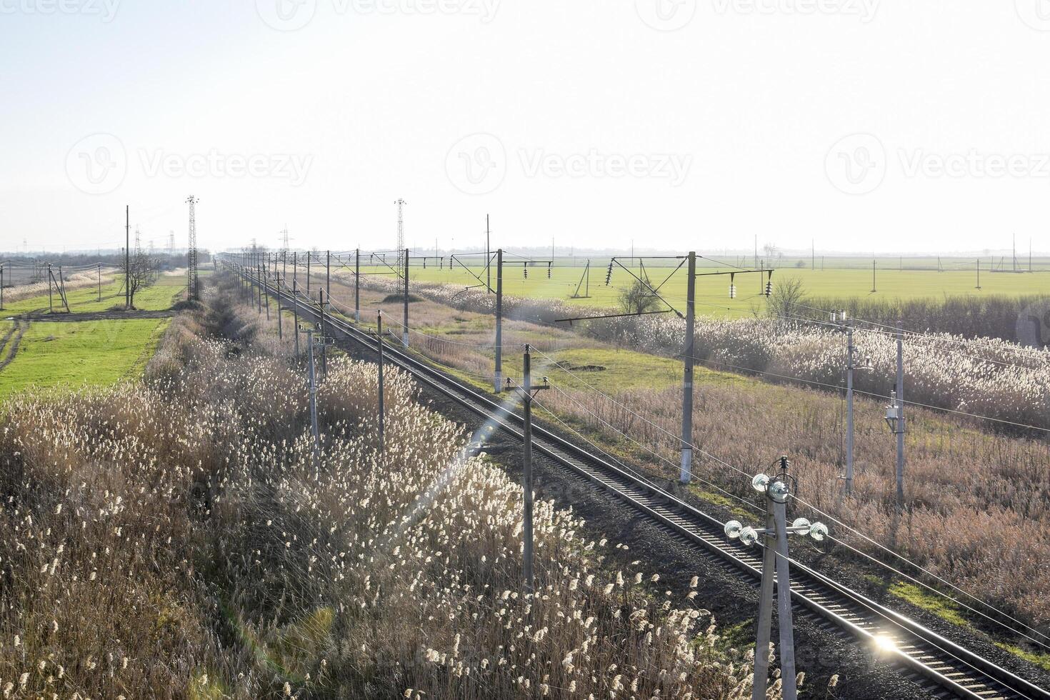 Plot railway. Top view on the rails. High-voltage power lines for electric trains photo