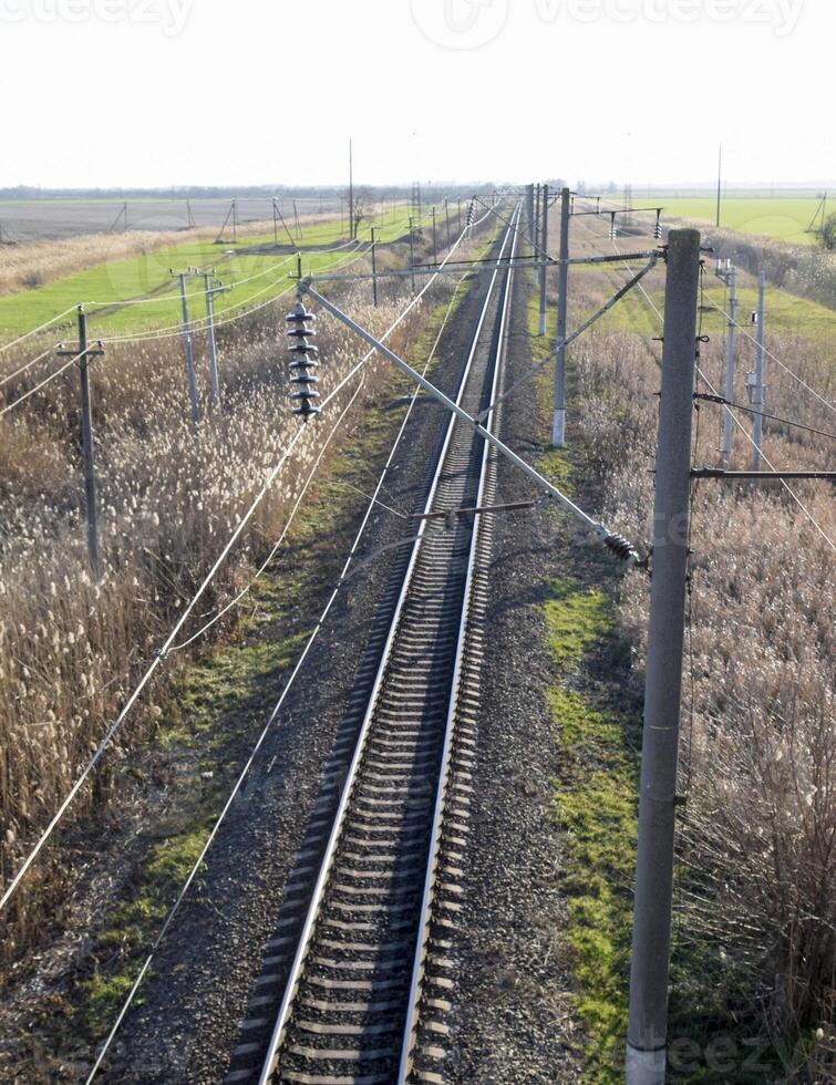 Plot railway. Top view on the rails. High-voltage power lines for electric trains photo