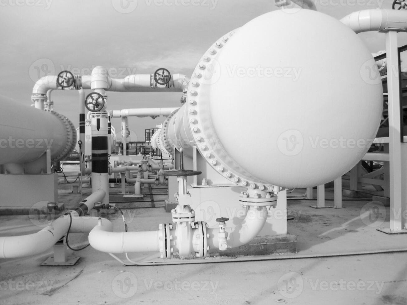 Heat exchangers in a refinery. The equipment for oil refining photo