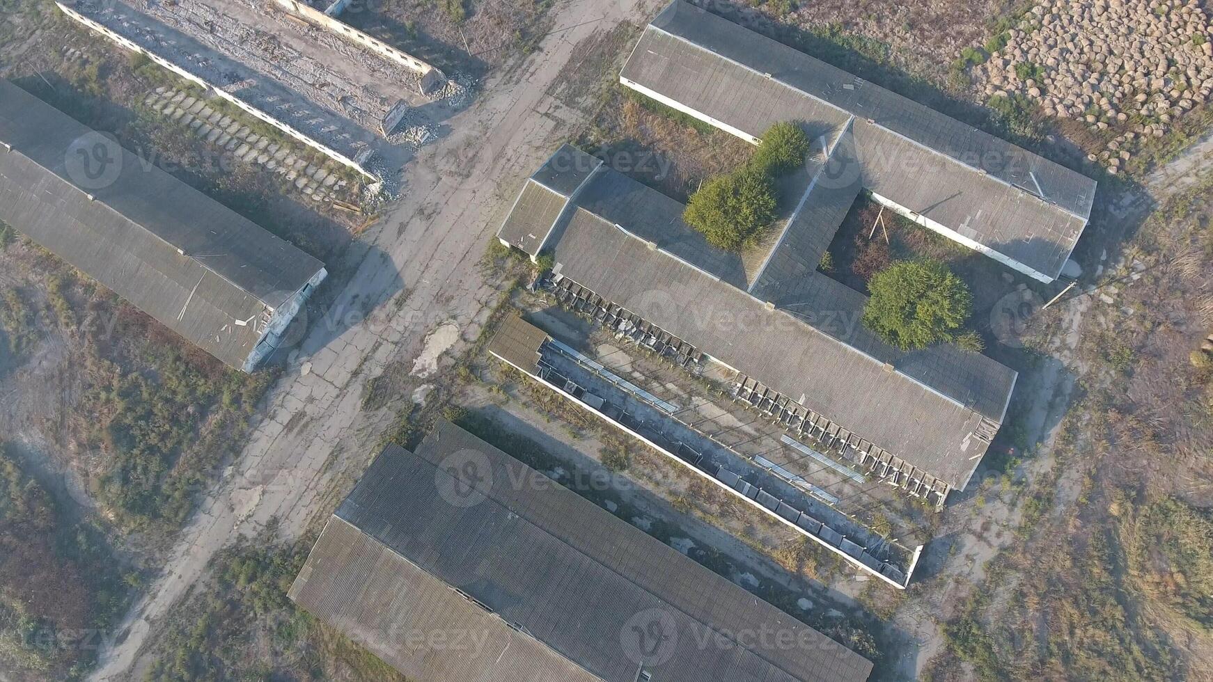 The building of an old farm for cattle. Top view of the farm. Storage of bales of hay on the old farm photo