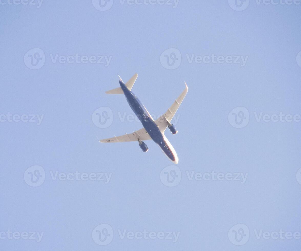 Passenger aircraft in the sky at low altitude flies to the airport to land. photo