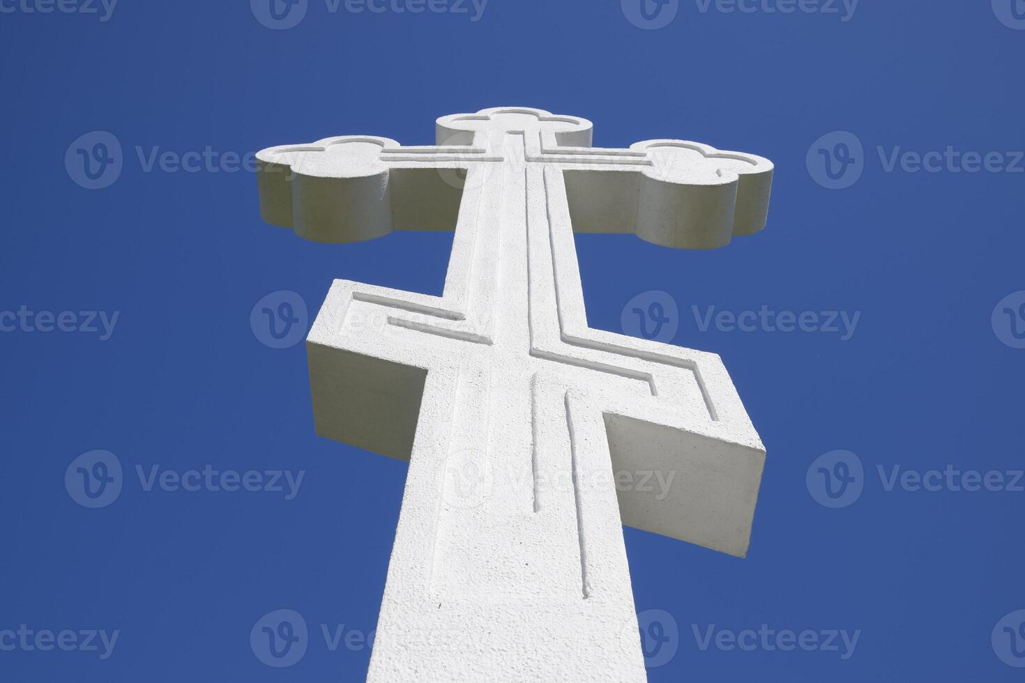 White orthodox christian cross on blue sky background. photo