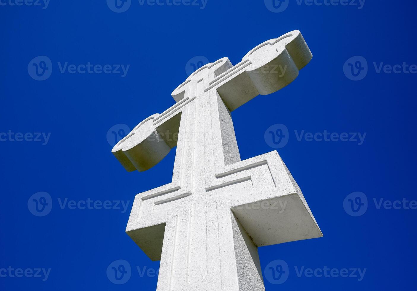 White orthodox christian cross on blue sky background. photo