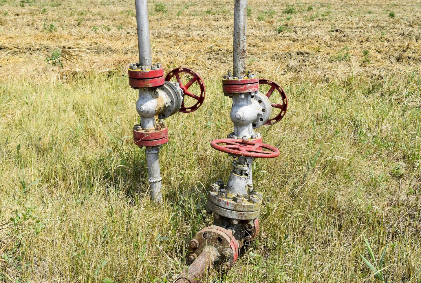 Manual shut-off valve on oil well. Oil well wellhead equipment. photo