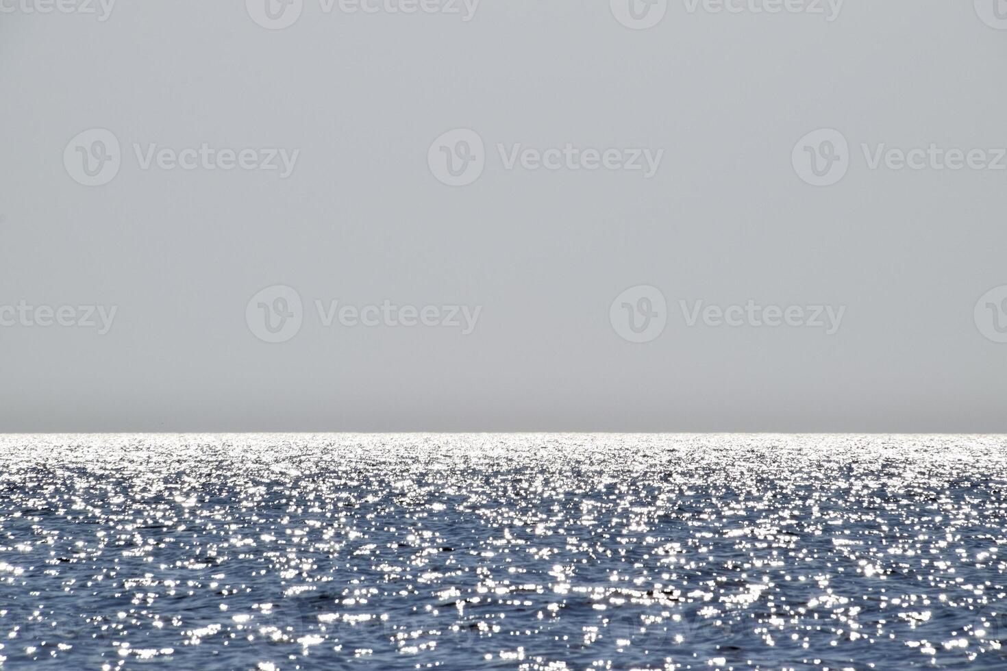 Sea line of the horizon. Sea and sky. The waves and glare of the sun are reflected from the waves of the sea. Seascape. photo