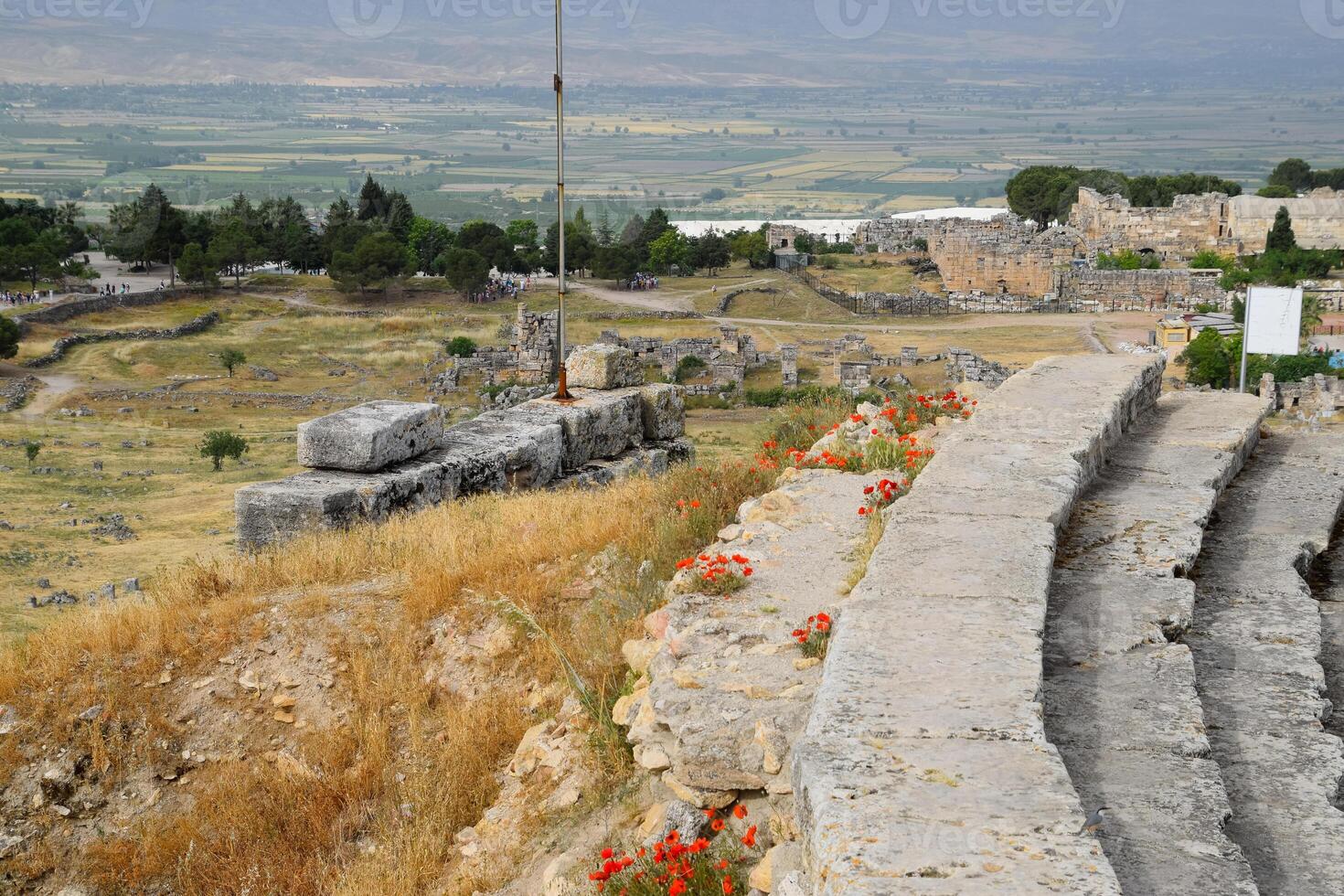 top of the steps of the amphitheater, stones and boulders on the hill. photo