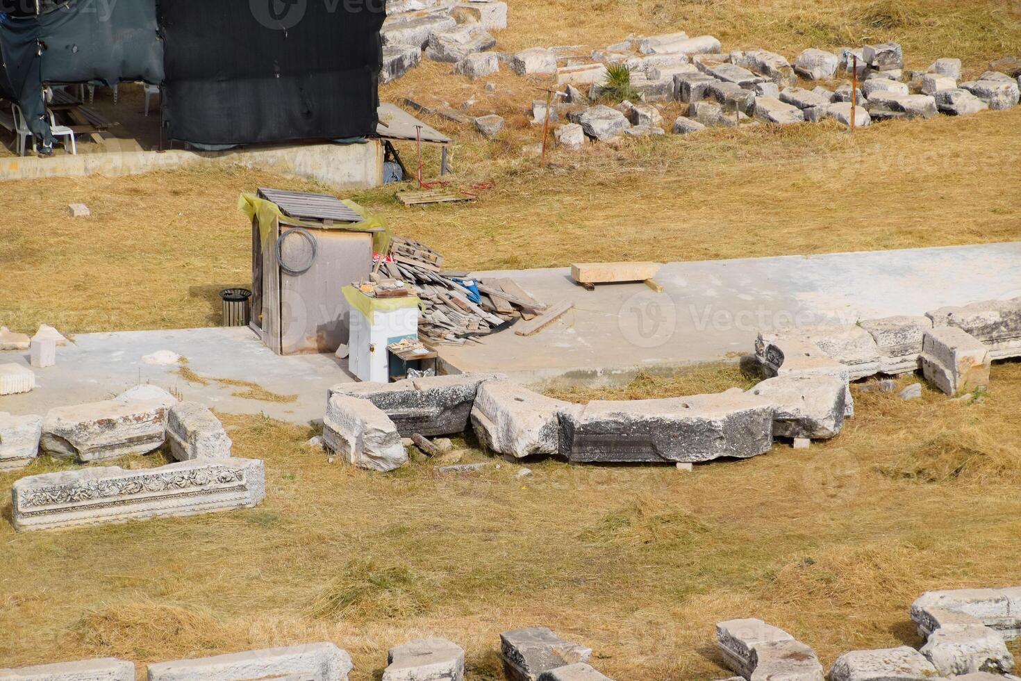 Top view of the excavation site in ruined ancient city of Hierapolis. The remains of destroyed buildings and columns. photo