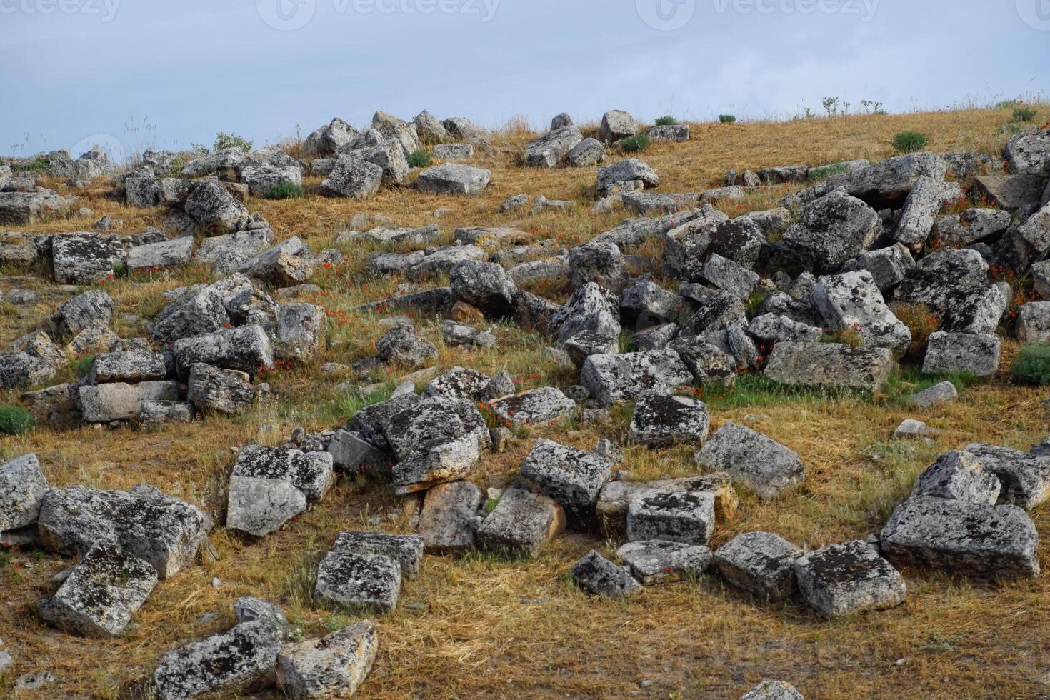 Huge blocks of a wall destroyed by an earthquake. Ruins of the city of Hierapolis photo