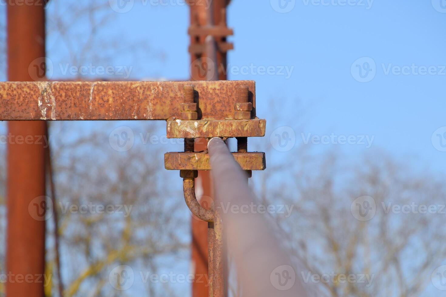 Fastening clamp on the steel cable of the bridge photo