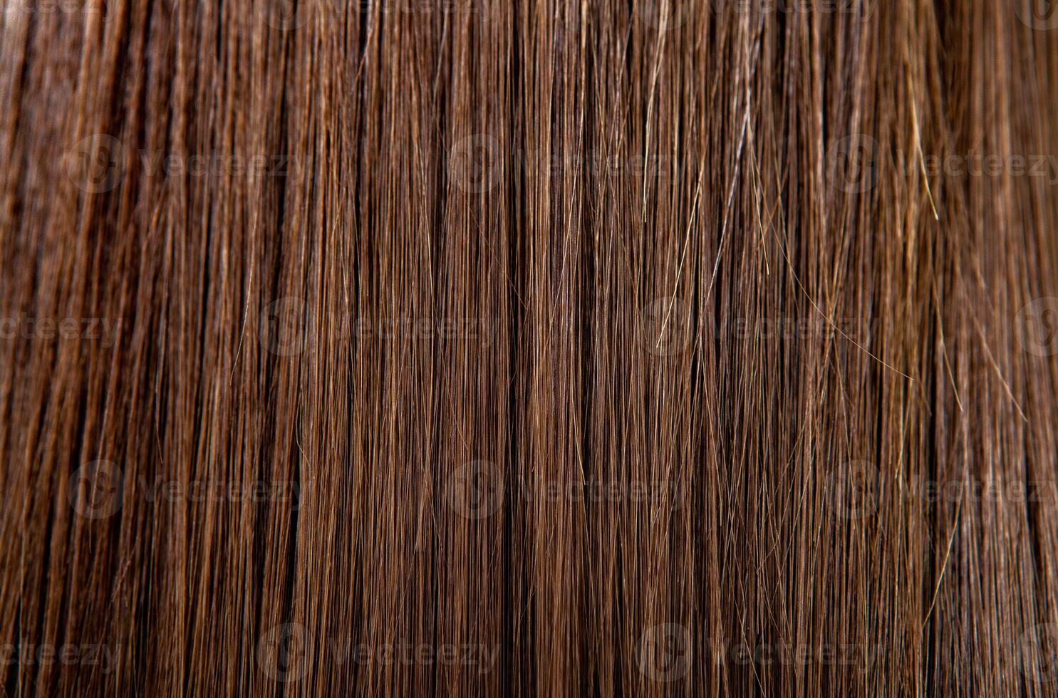 cerca arriba de marrón pelo como antecedentes. textura de natural cabello. foto