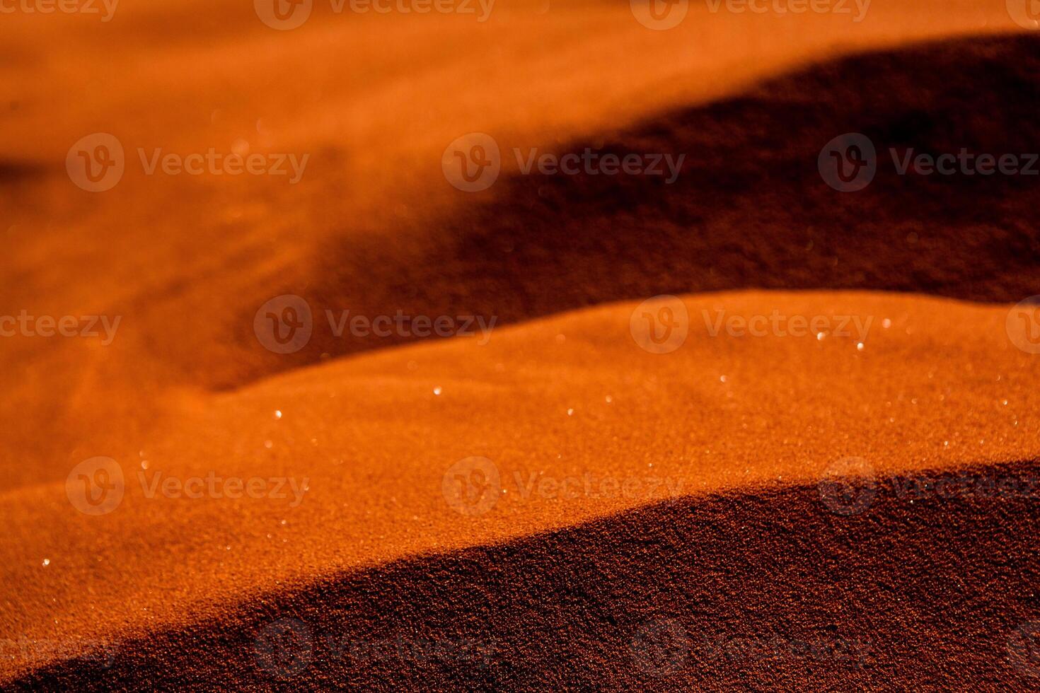 Wadi Rum Desert in Jordan. On the Sunset. Panorama of beautiful sand pattern on the dune. Desert landscape in Jordan. photo