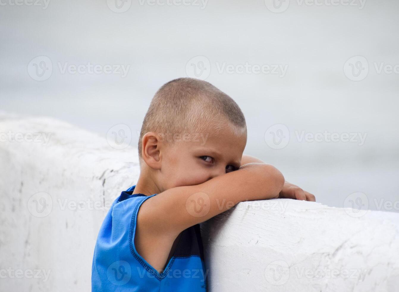 The child was offended. Anger and resentment of a little boy. The baby is crying photo