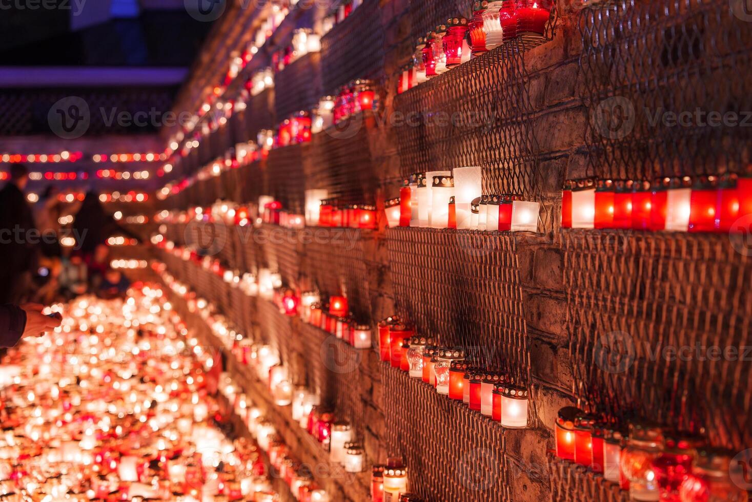 Candlelit Remembrance Display in Red for Latvia's Independence Day photo