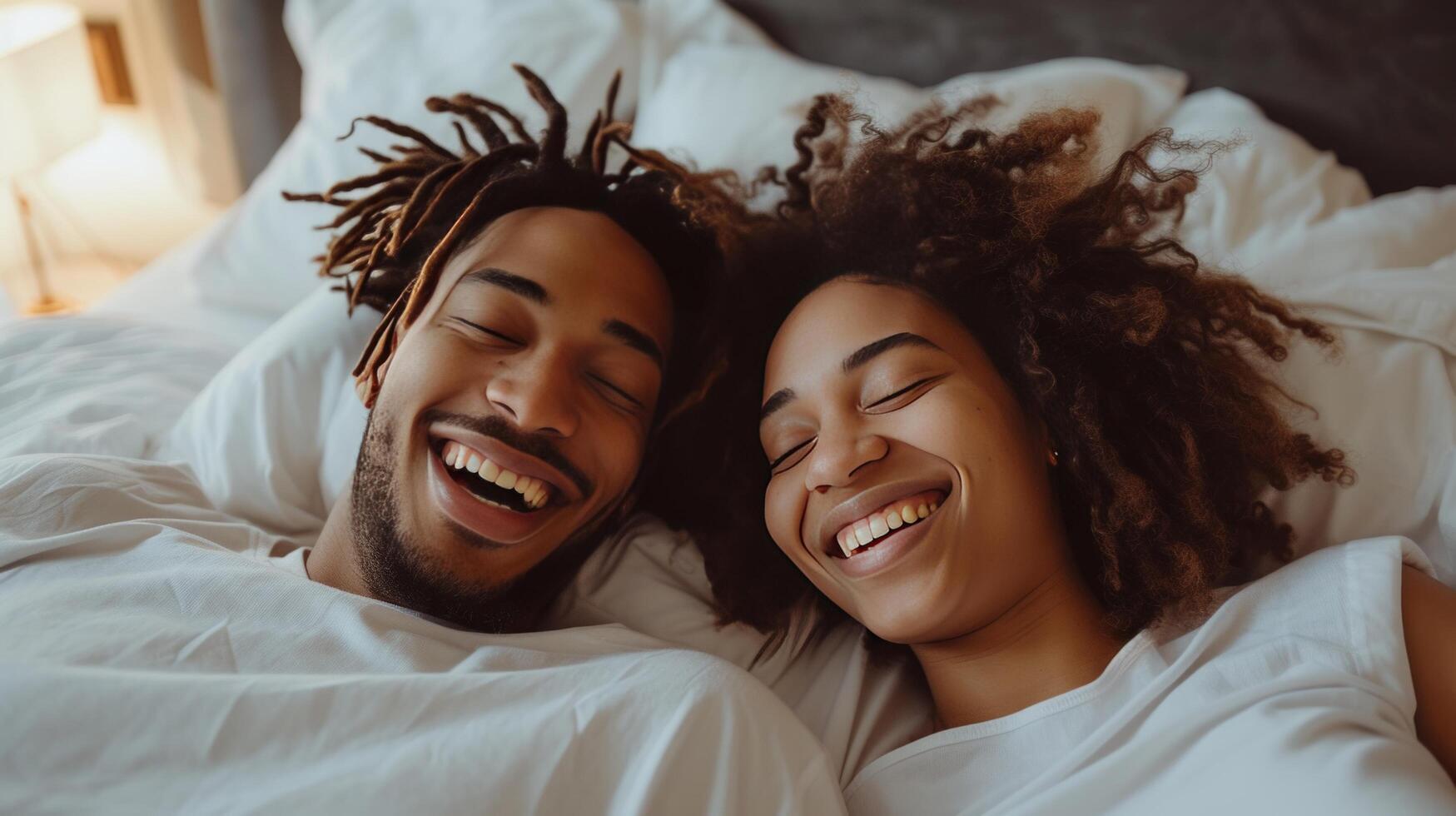 AI generated Young couple lying in bed and laughing photo